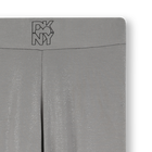 Leggings in jersey argentato con paillettes DKNY 
                    BAMBINA