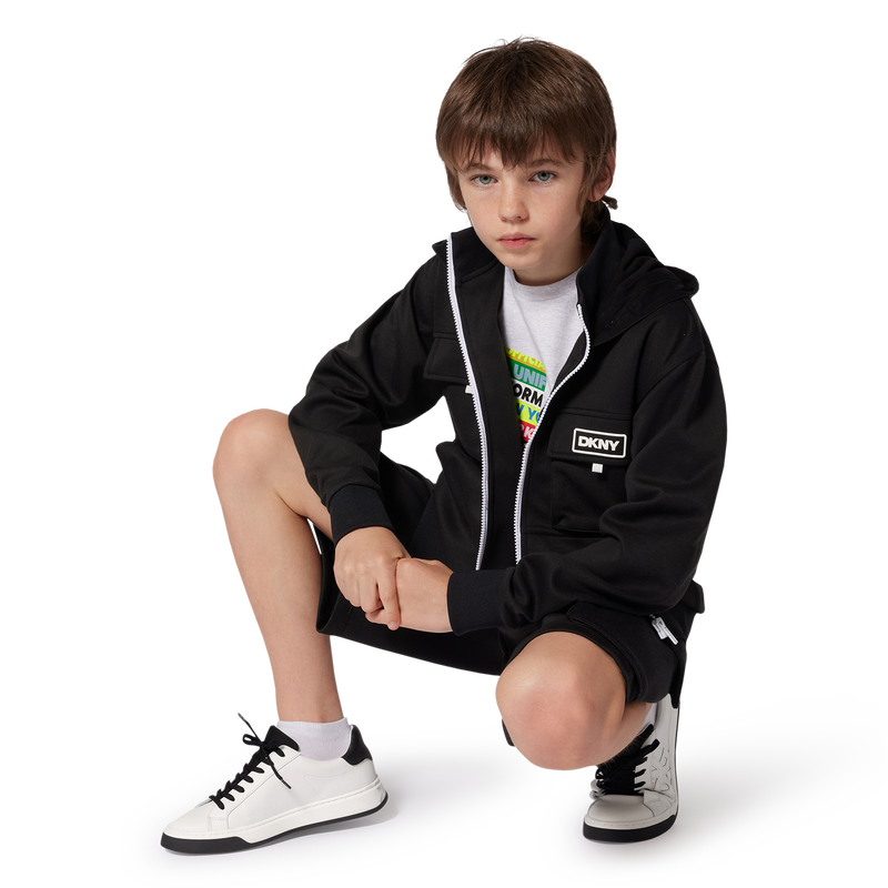 Sneakers con lacci in pelle DKNY 
                    UNISEX