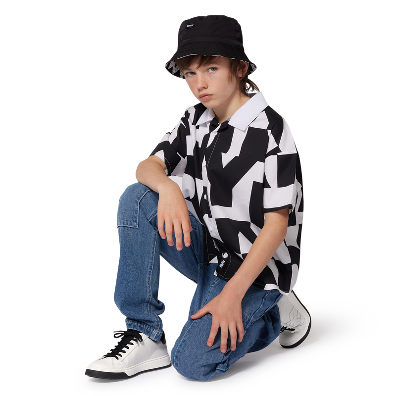 Sneakers con lacci in pelle DKNY 
                    UNISEX