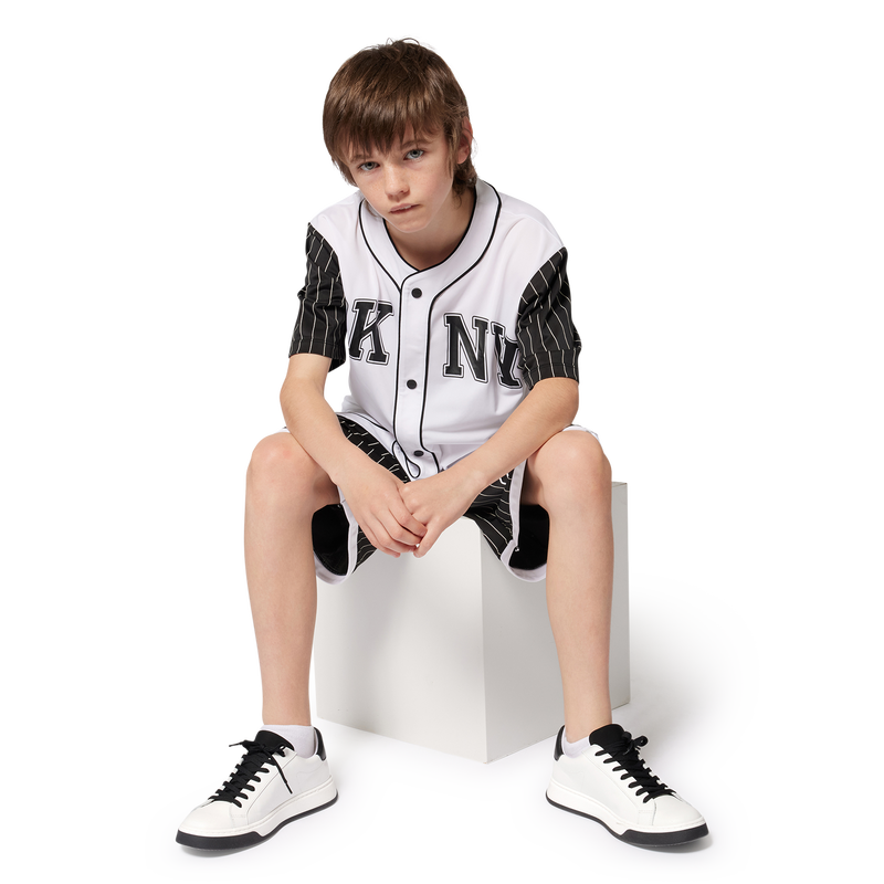 Sneakers con lacci in pelle DKNY 
                    UNISEX