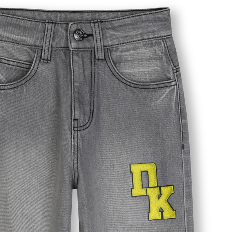 Pantaloni in denim DKNY 
                        UNISEX